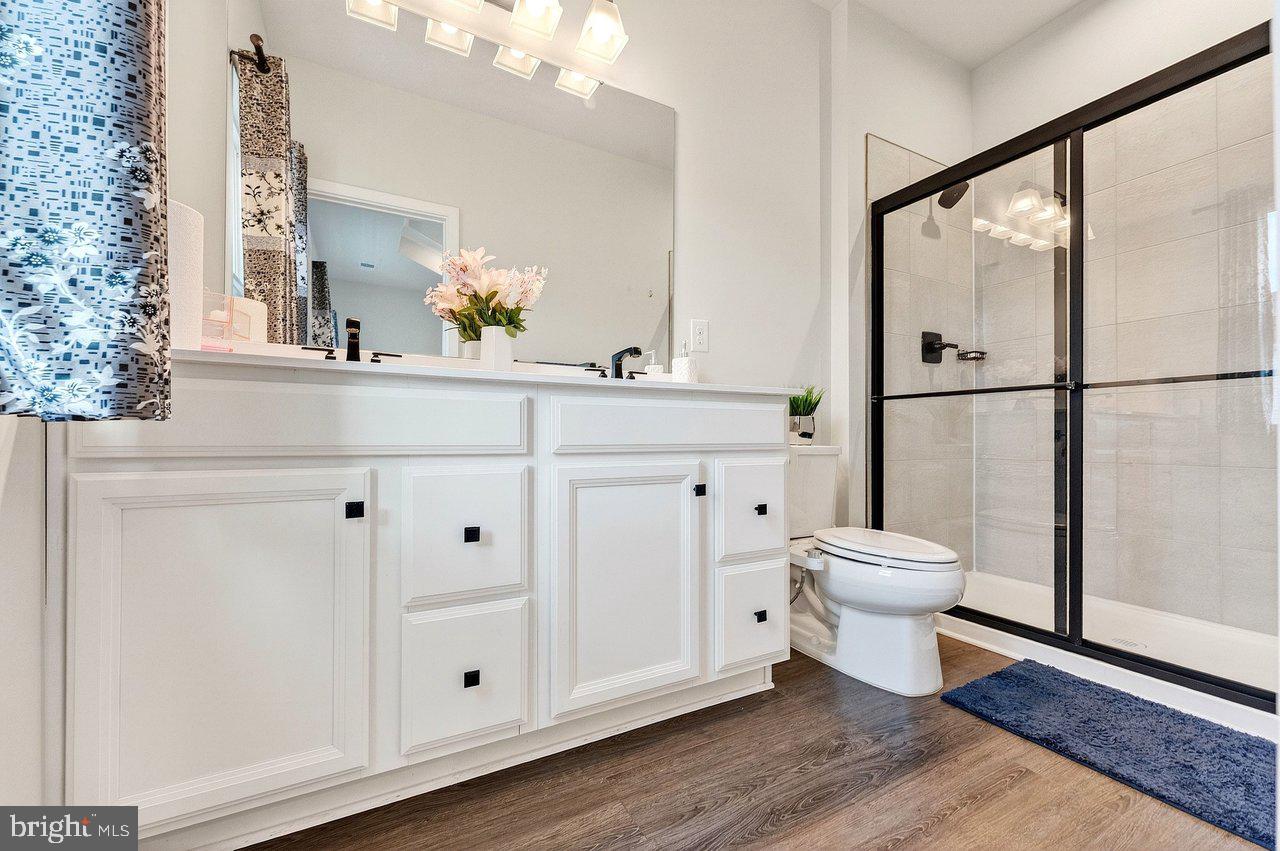 39 Sage Way Mount Laurel, NJ 08054 - Photo 13 of 32 a bathroom with a toilet sink and mirror