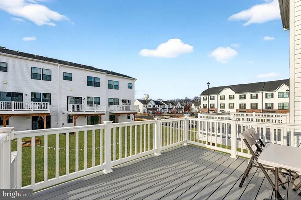 a view of a balcony with wooden floor