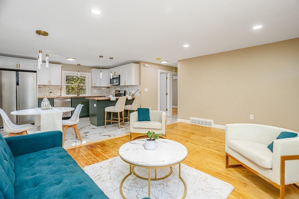 7 Groveland Street Ayer, MA 01432 - Photo 17 of 35 a living room with furniture and a wooden floor