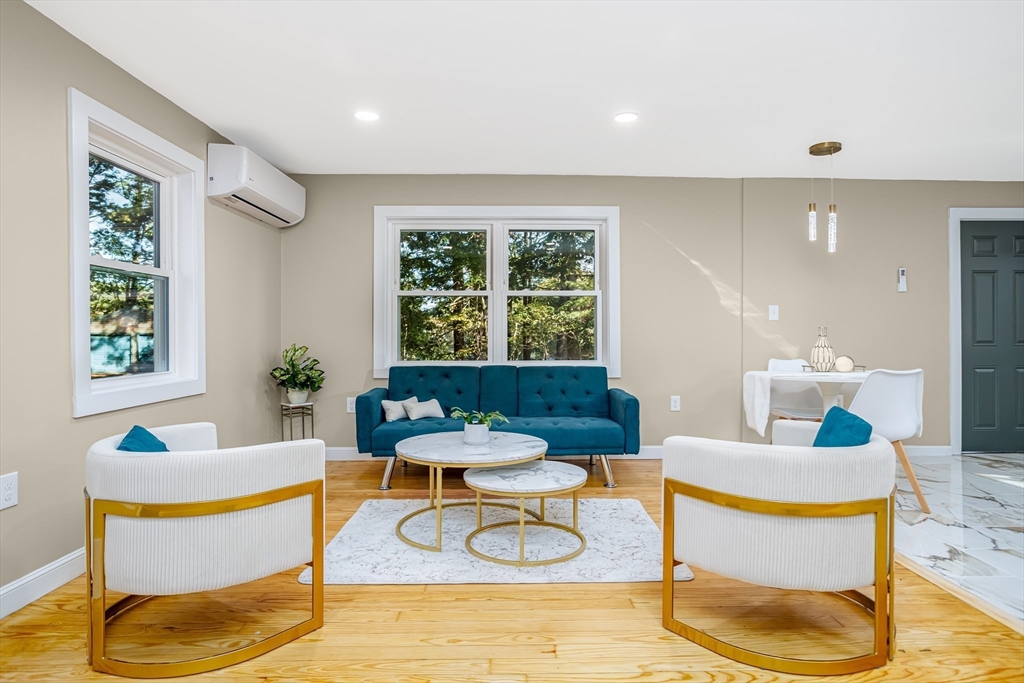 7 Groveland Street Ayer, MA 01432 - Photo 19 of 35 a living room with a couch and a table