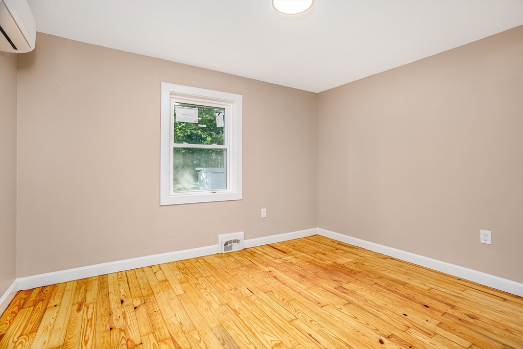 7 Groveland Street Ayer, MA 01432 - Photo 29 of 35 a view of a room with a wooden floor and a window
