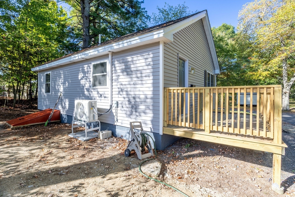 7 Groveland Street Ayer, MA 01432 - Photo 3 of 35 a backyard of a house with yard and outdoor seating