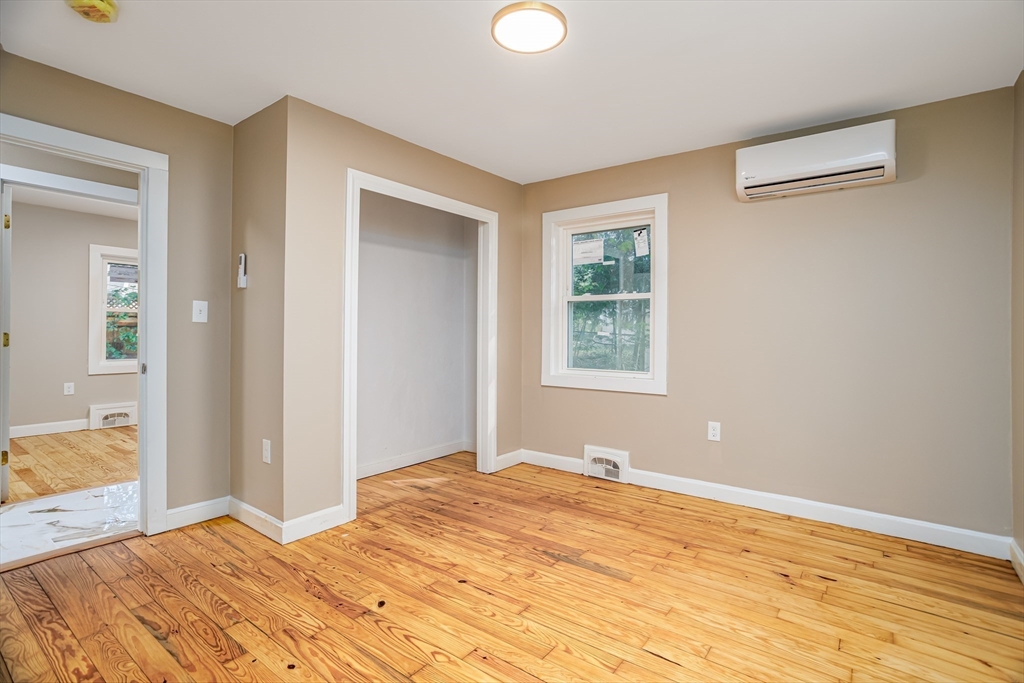 7 Groveland Street Ayer, MA 01432 - Photo 32 of 35 a bedroom with a bed and a window