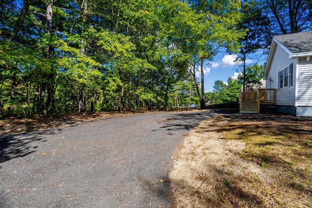 7 Groveland Street Ayer, MA 01432 - Photo 4 of 35 a view of a yard with a tree