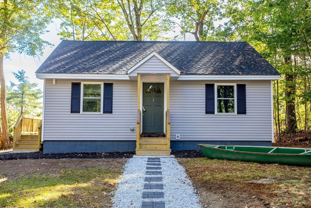 7 Groveland Street Ayer, MA 01432 - Photo 7 of 35 a front view of a house with a yard