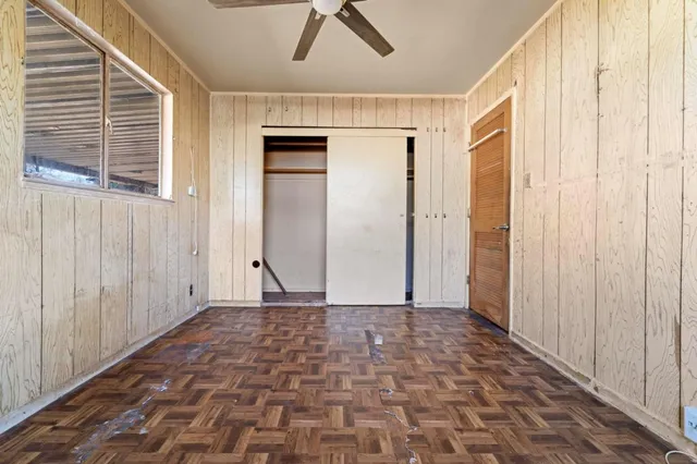 a view of a hallway with a door