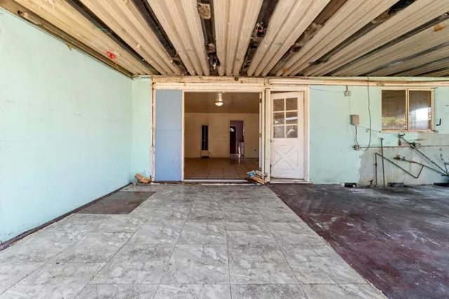 a view of a house with swimming pool and sitting area