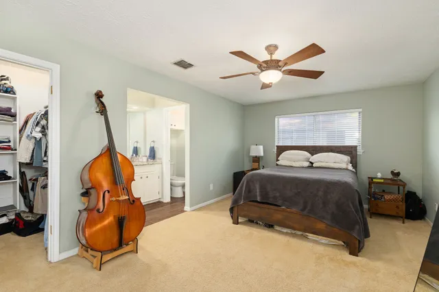a bedroom with bed and window