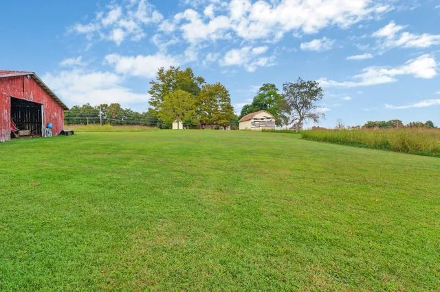 a view of a big yard with a house