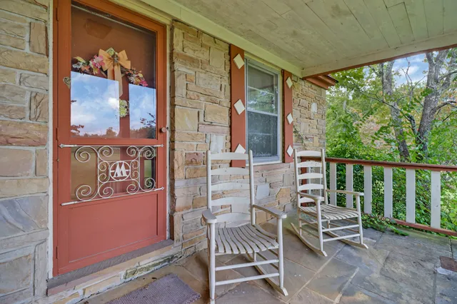a view of balcony with furniture