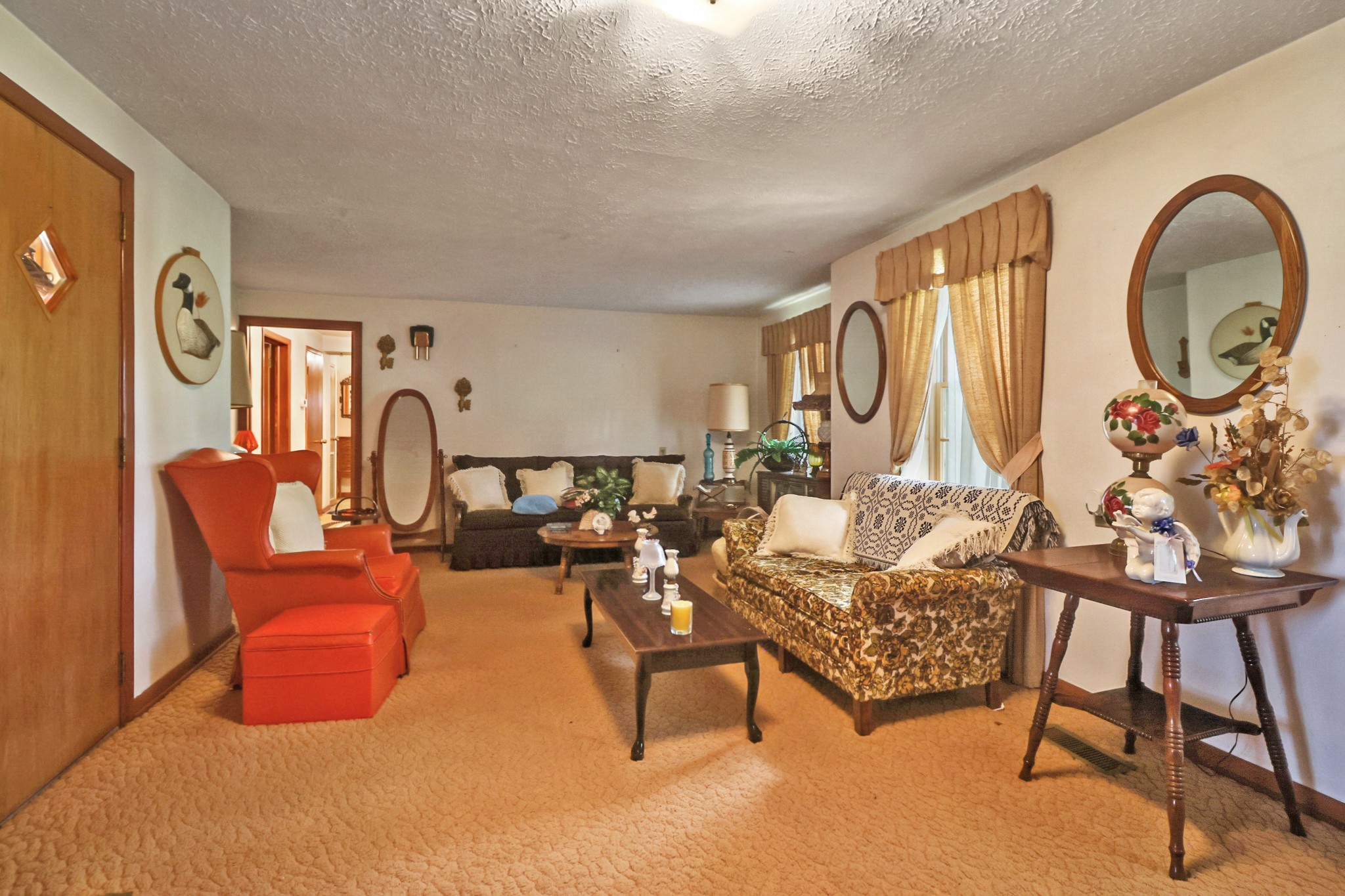 1386 Pigeon Ridge Road Crossville, TN 38572 - Photo 26 of 41 a living room with furniture a large window and a chandelier