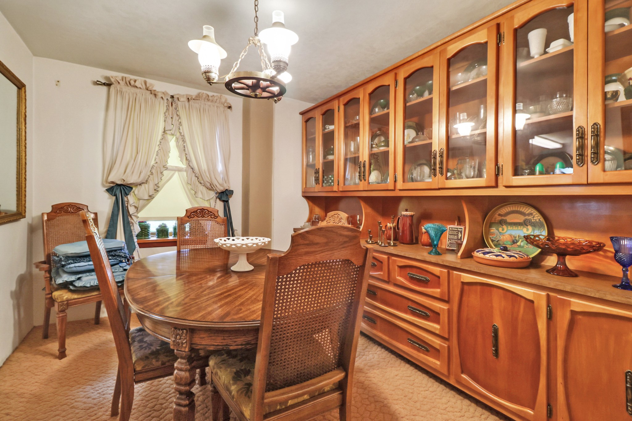1386 Pigeon Ridge Road Crossville, TN 38572 - Photo 28 of 41 a dining room with furniture a chandelier and wooden floor
