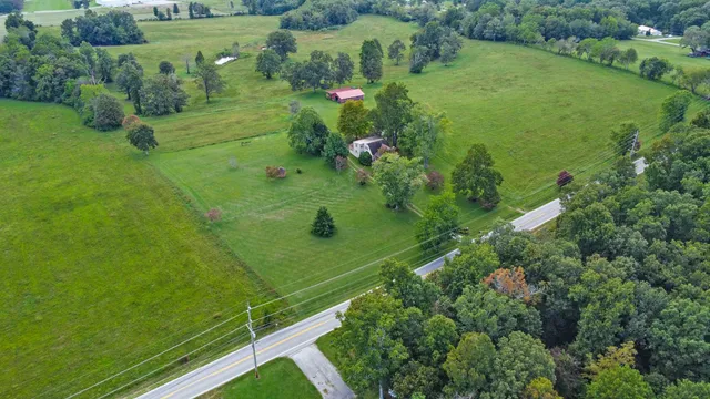 a view of a garden with a building in the background