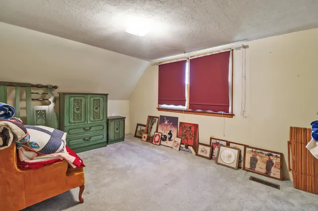 a room with furniture and a chair