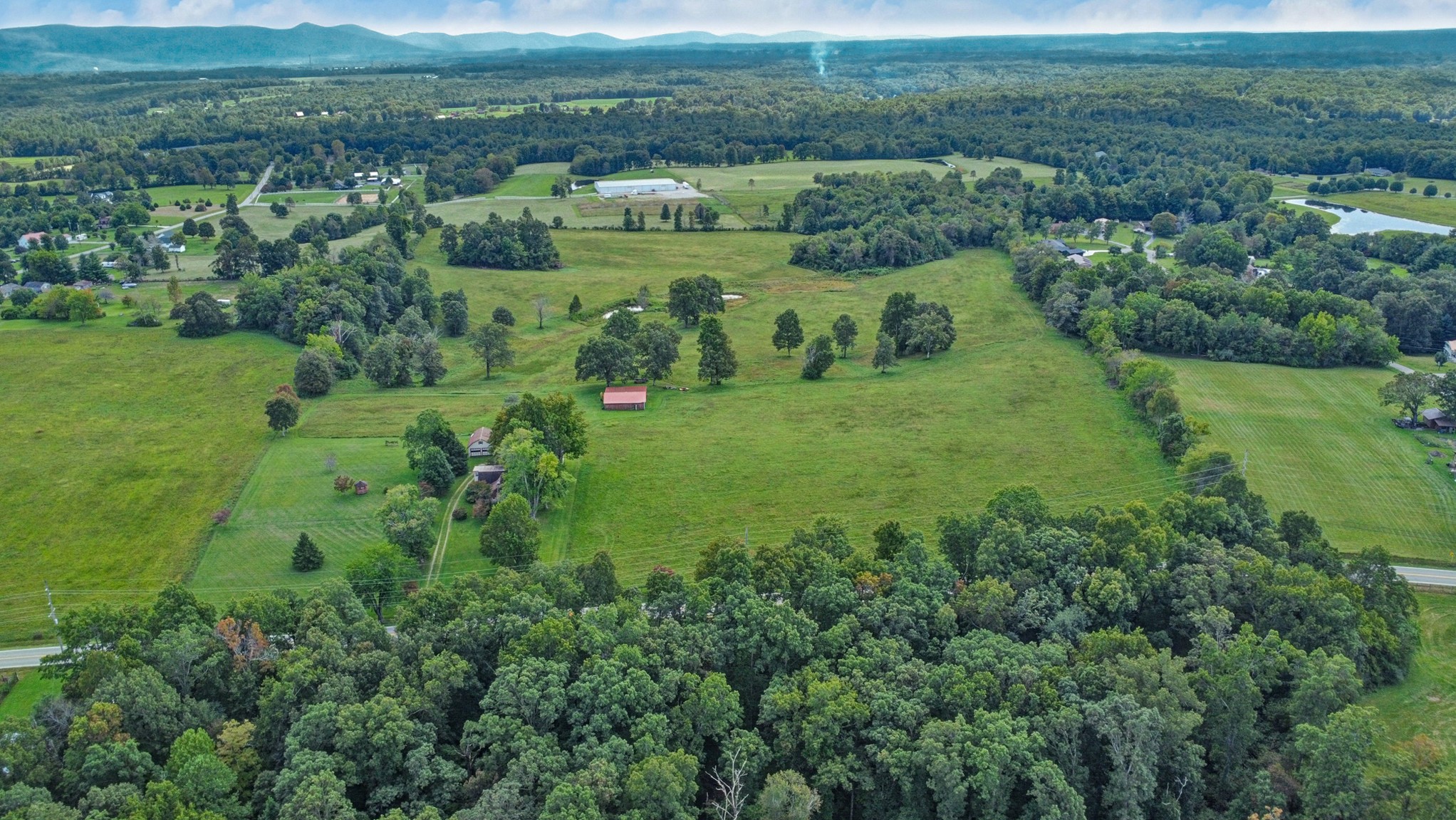1386 Pigeon Ridge Road Crossville, TN 38572 - Photo 38 of 41 a view of a lush green hillside and houses