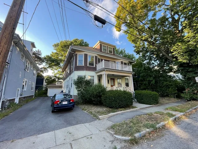 a car parked in front of a house