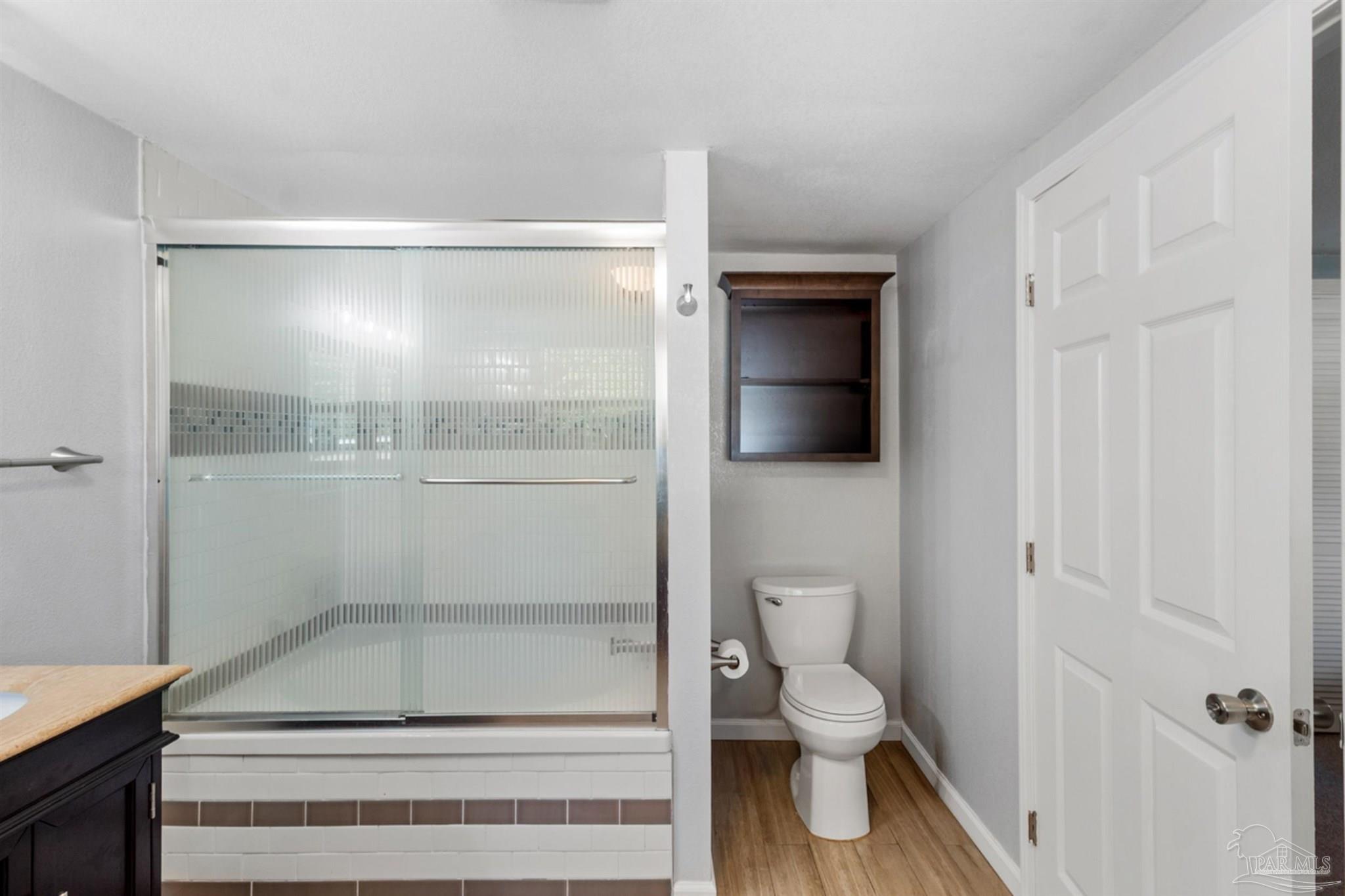 6608 Magnolia Street Milton, FL 32570 - Photo 24 of 36 a bathroom with a toilet and a shower