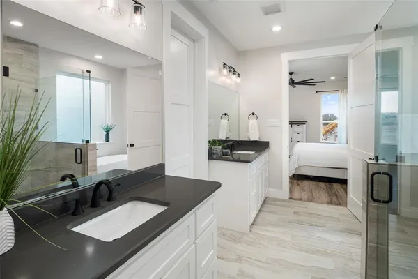 a large bathroom with double vanity sink and a mirror