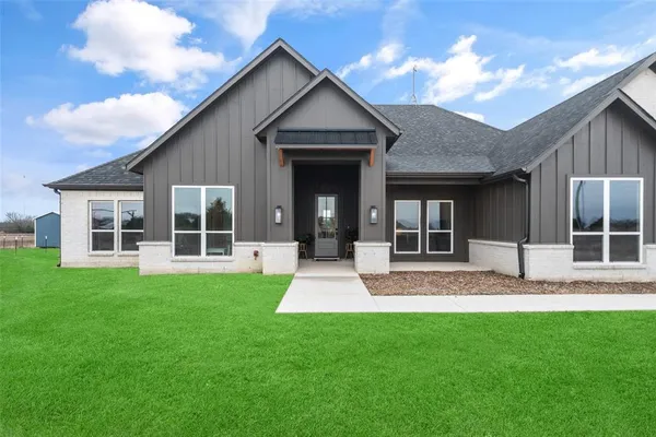 front view of a house with a yard