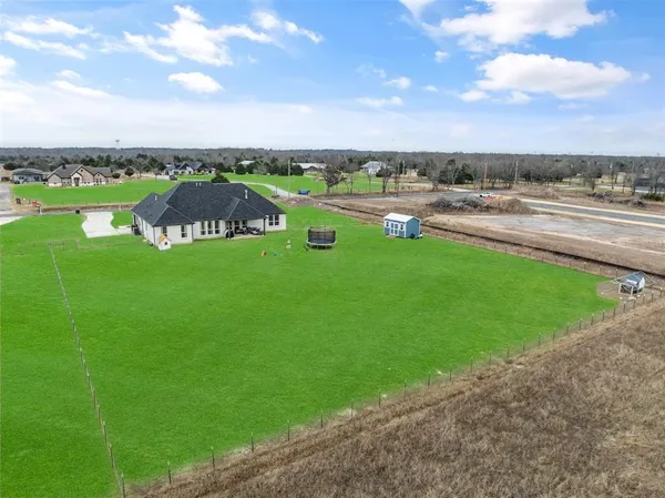 a view of a city street and ocean view