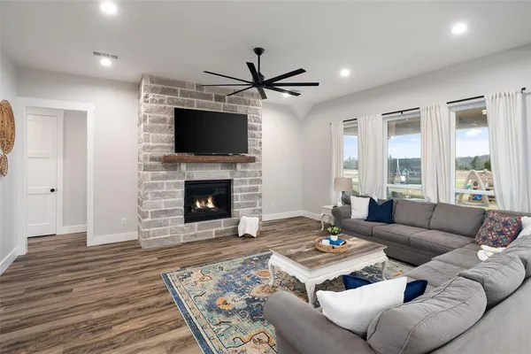 a living room with furniture and a fireplace
