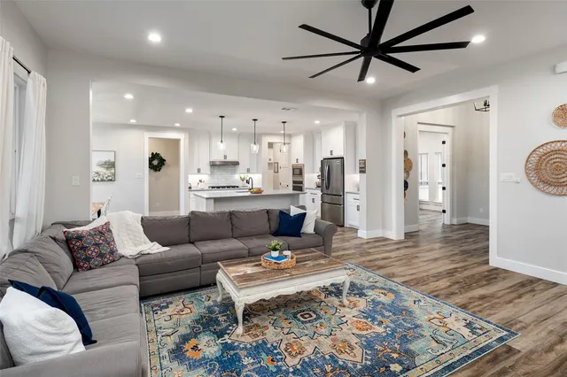 a living room with furniture and a rug