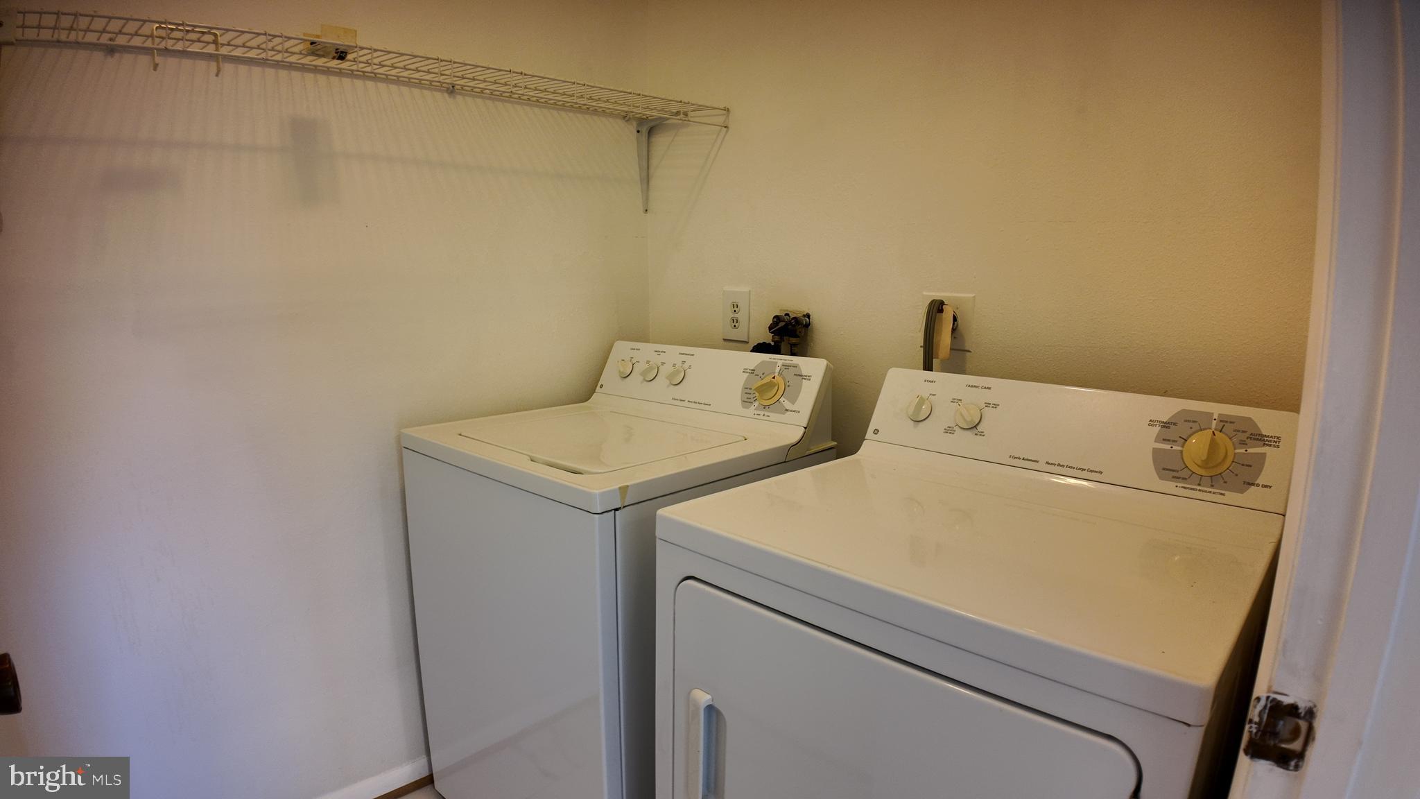 15311 Beaverbrook Court, Unit 903B Silver Spring, MD 20906 - Photo 18 of 36 a utility room with dryer and washer