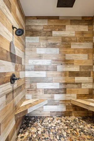 a bathroom with bathtub and shower