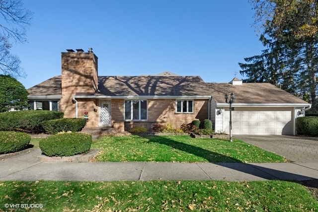 457 Utley Road Elmhurst, IL 60126 - Photo 1 of 23 a front view of a house with a garden and plants