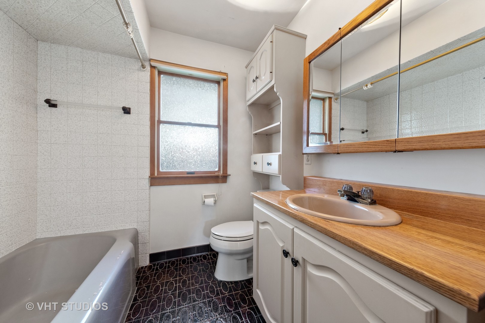 457 Utley Road Elmhurst, IL 60126 - Photo 13 of 23 a bathroom with a granite countertop sink a toilet and a bathtub