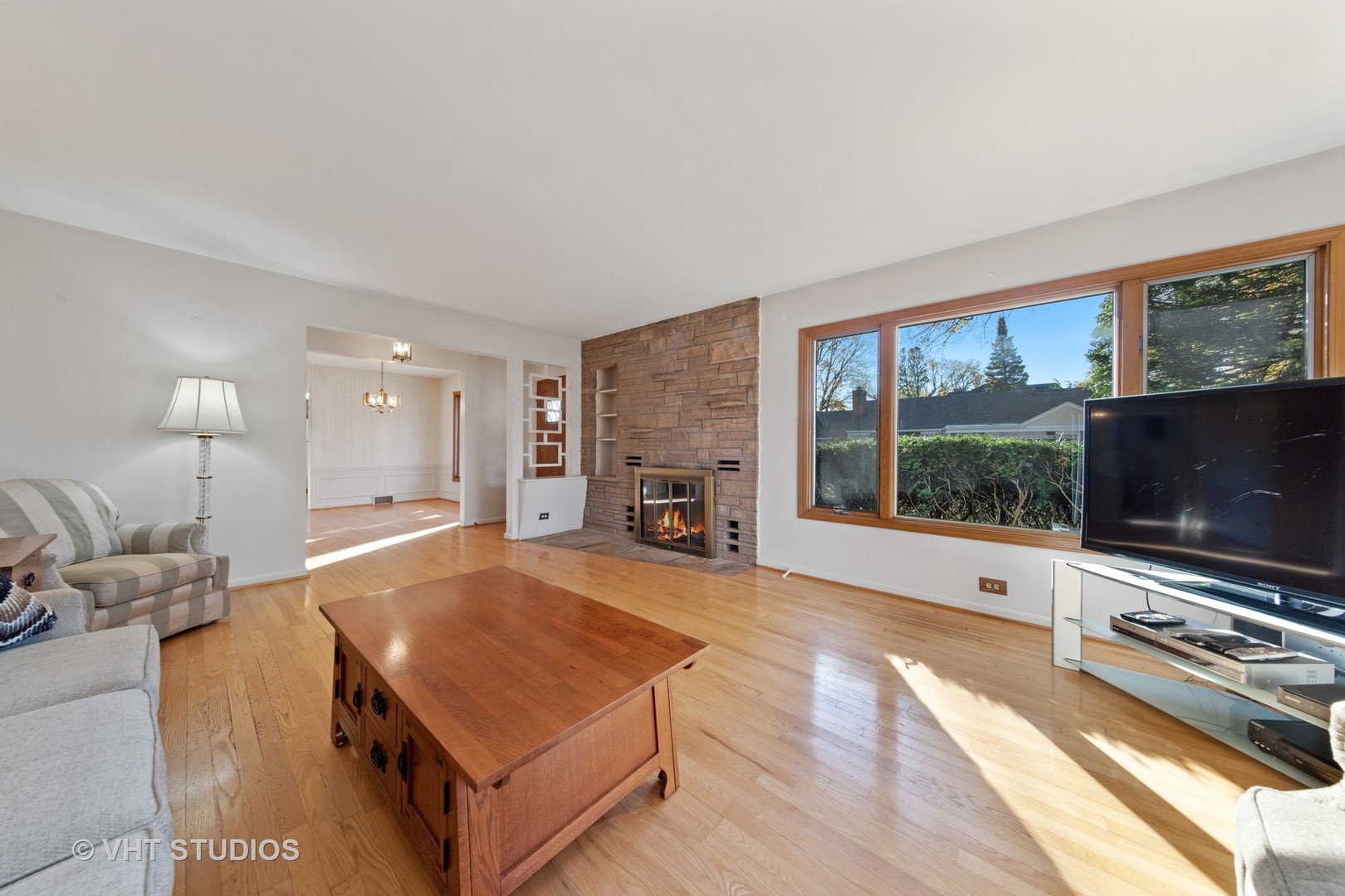 457 Utley Road Elmhurst, IL 60126 - Photo 5 of 23 a living room with furniture fireplace and flat screen tv