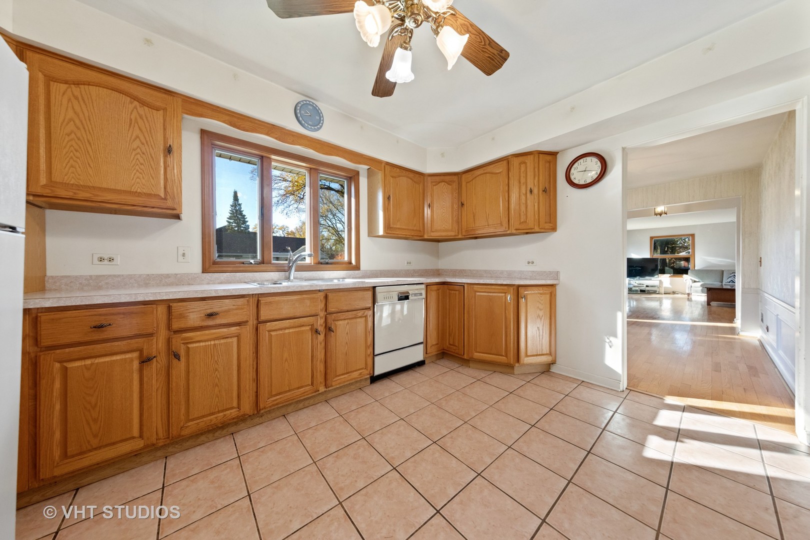 457 Utley Road Elmhurst, IL 60126 - Photo 8 of 23 a kitchen with a sink cabinets and window