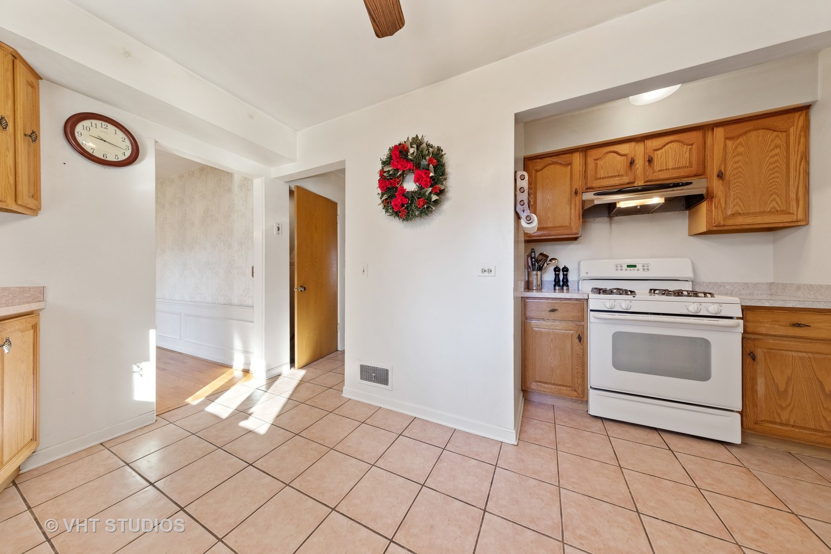 457 Utley Road Elmhurst, IL 60126 - Photo 10 of 23 a open kitchen with white cabinets and white appliances