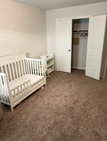 a living room with a couch and a dresser