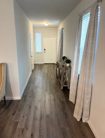 a view of entryway with wooden floor