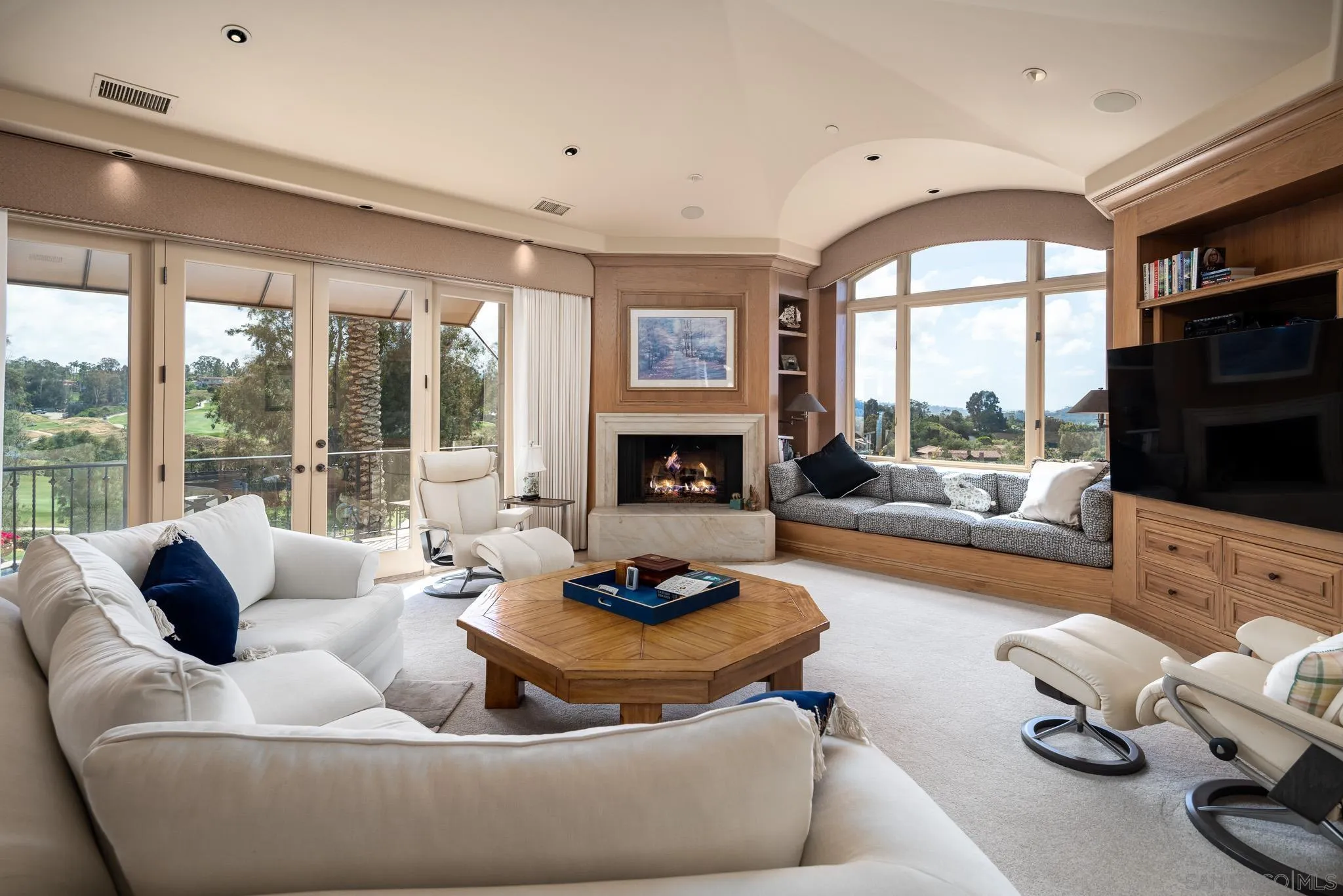 7756 St Andrews Road Rancho Santa Fe, CA 92067 - Photo 20 of 46 a living room with furniture fireplace and flat screen tv