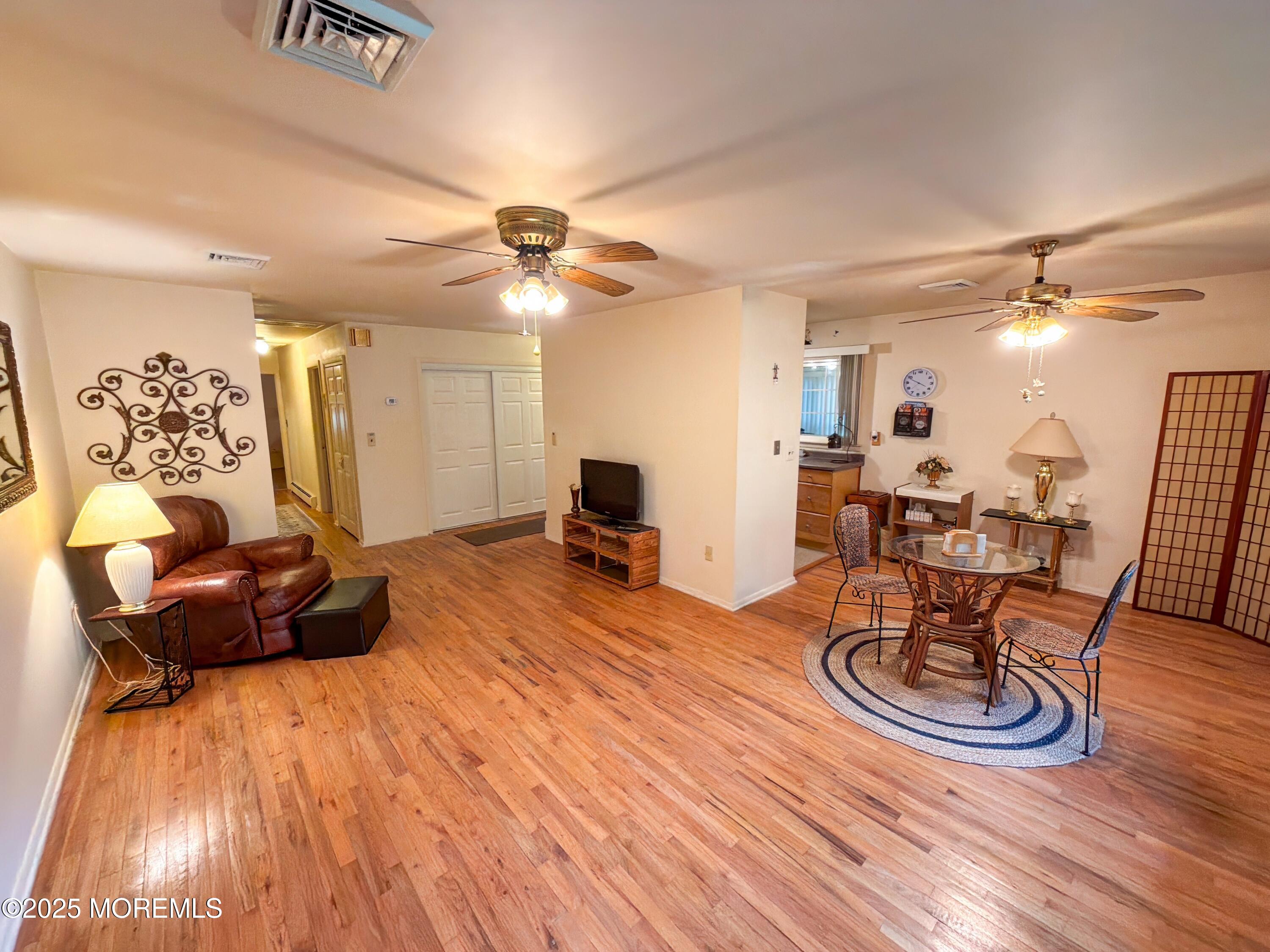 2 Corey Lane, Unit C Jackson, NJ 08527 - Photo 12 of 32 a living room with furniture and a wooden floor
