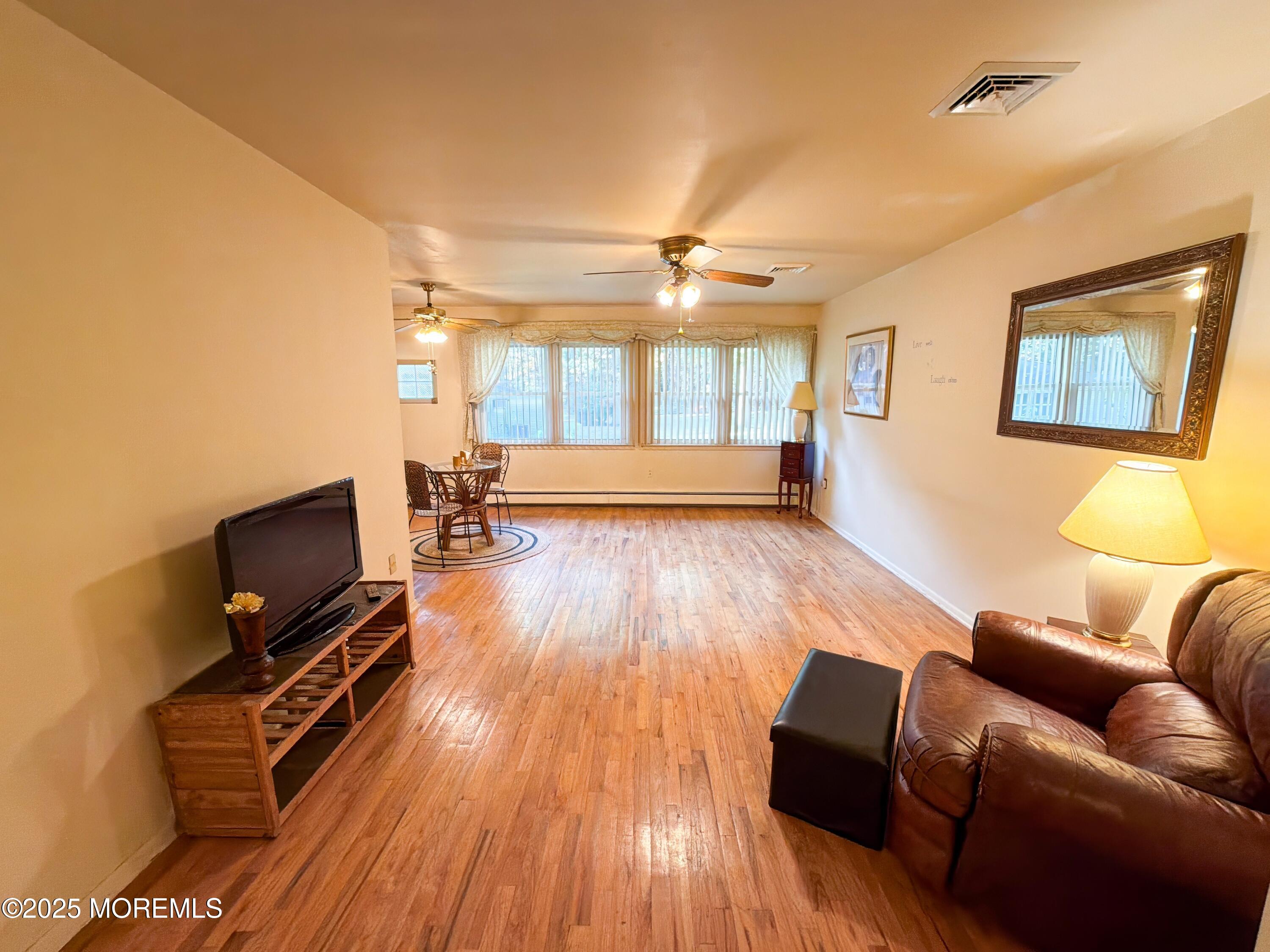 2 Corey Lane, Unit C Jackson, NJ 08527 - Photo 13 of 32 a living room with furniture and a flat screen tv