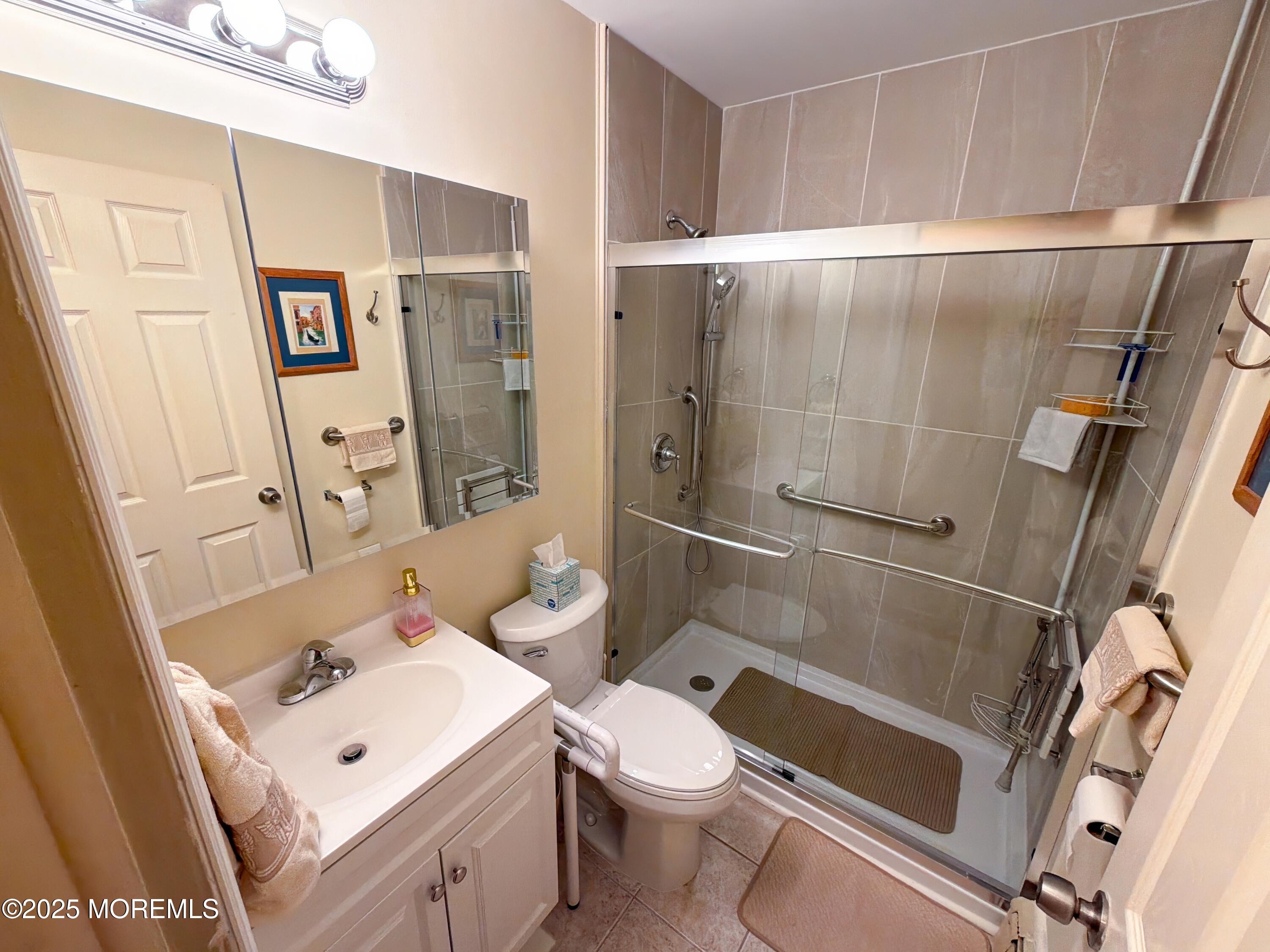 2 Corey Lane, Unit C Jackson, NJ 08527 - Photo 15 of 32 a white toilet sitting next to a bathroom sink