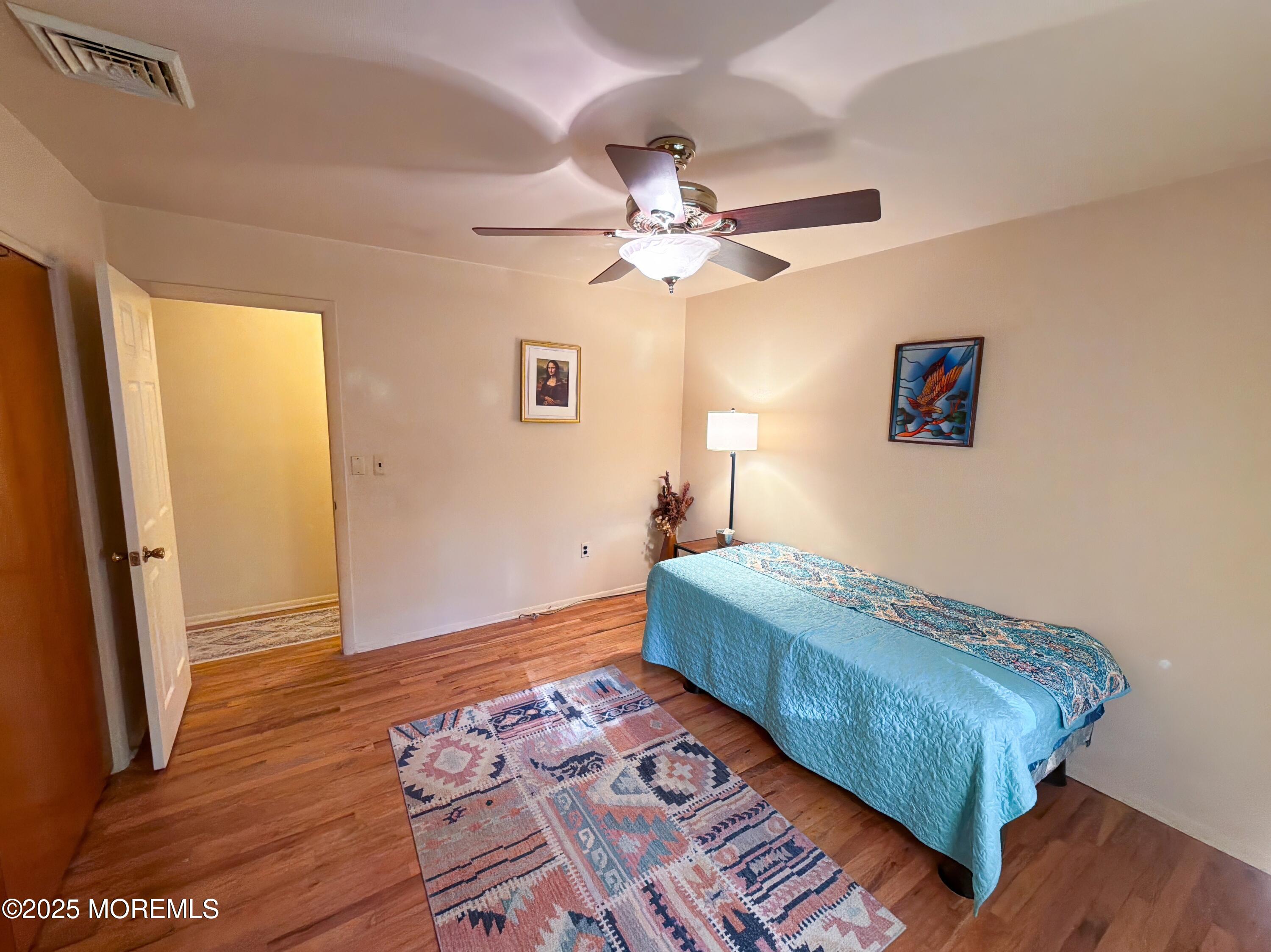 2 Corey Lane, Unit C Jackson, NJ 08527 - Photo 18 of 32 a bedroom with a bed and a window