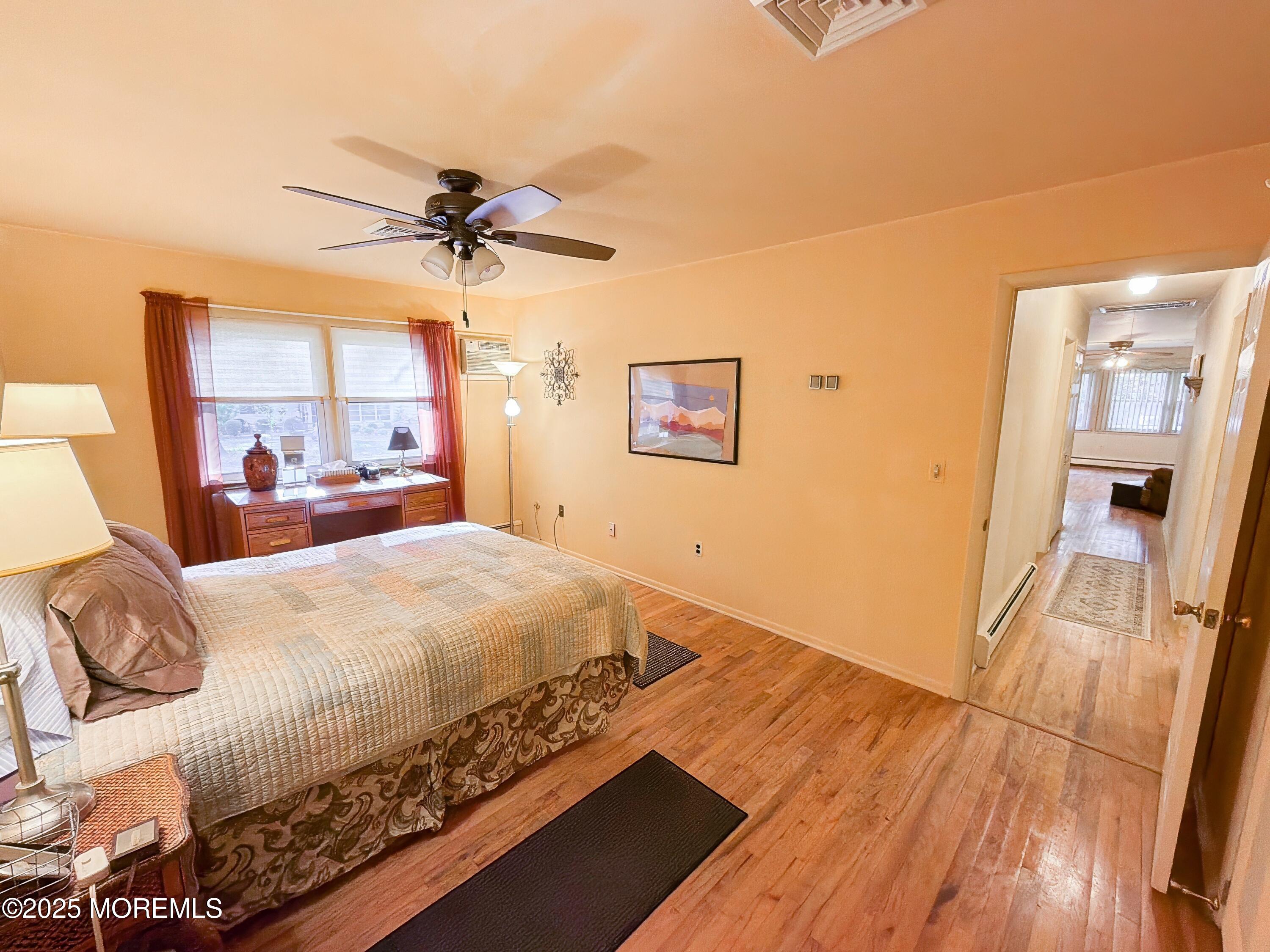2 Corey Lane, Unit C Jackson, NJ 08527 - Photo 22 of 32 a bedroom with a bed and a mirror