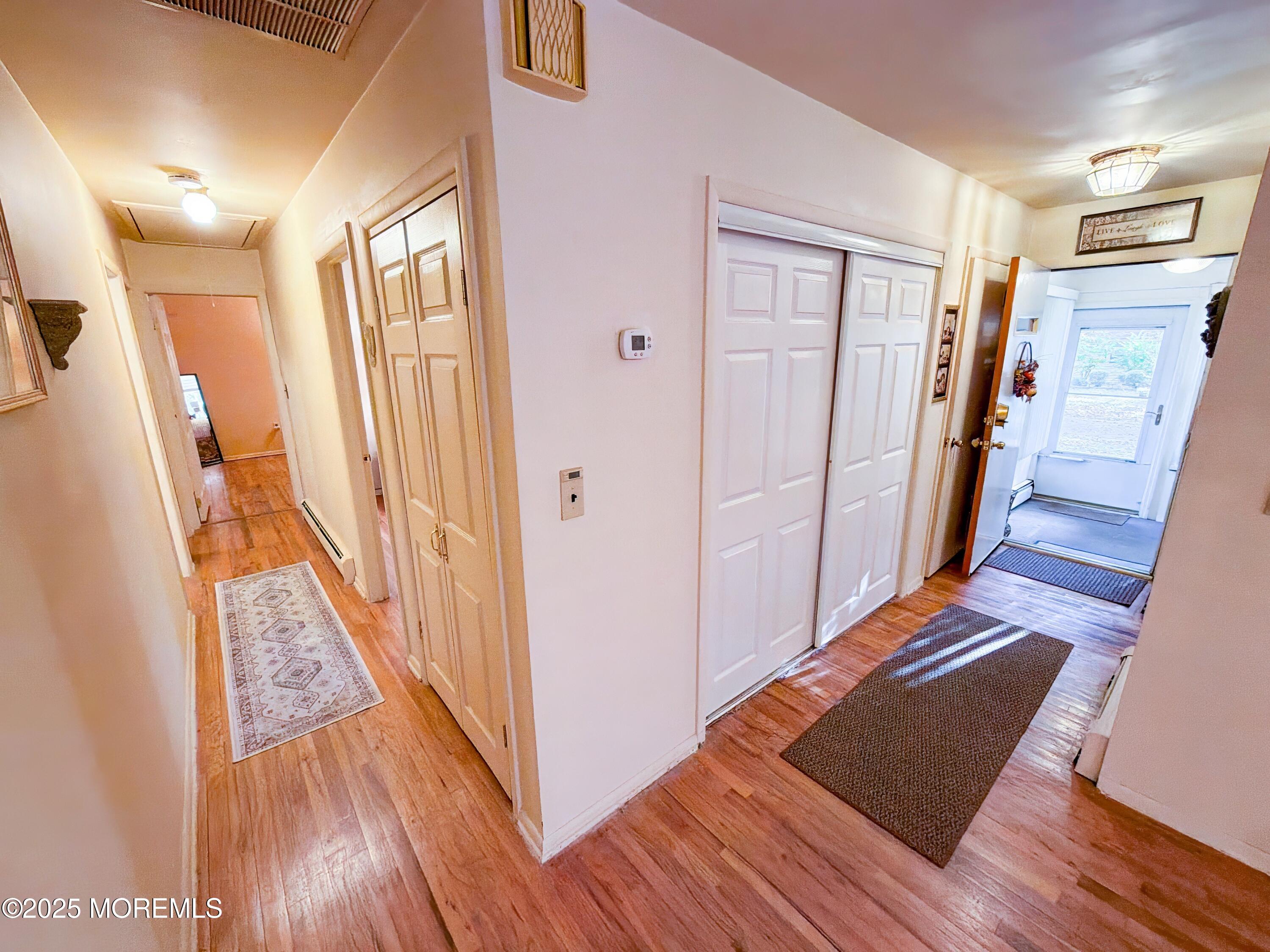 2 Corey Lane, Unit C Jackson, NJ 08527 - Photo 24 of 32 a view of a hallway with wooden floor and staircase