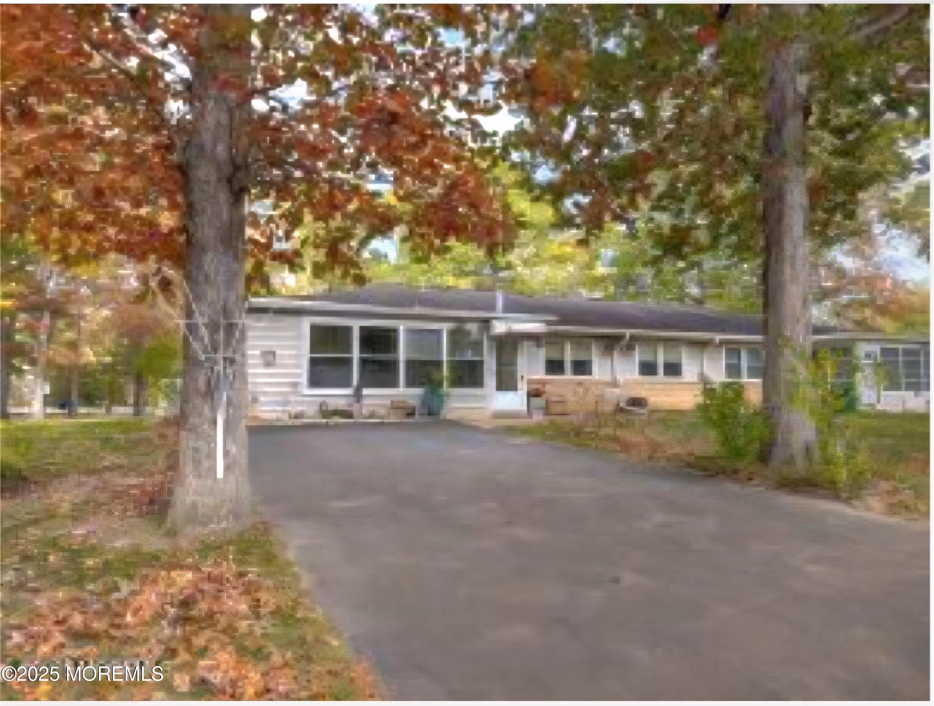 2 Corey Lane, Unit C Jackson, NJ 08527 - Photo 3 of 32 front view of a house with a garden