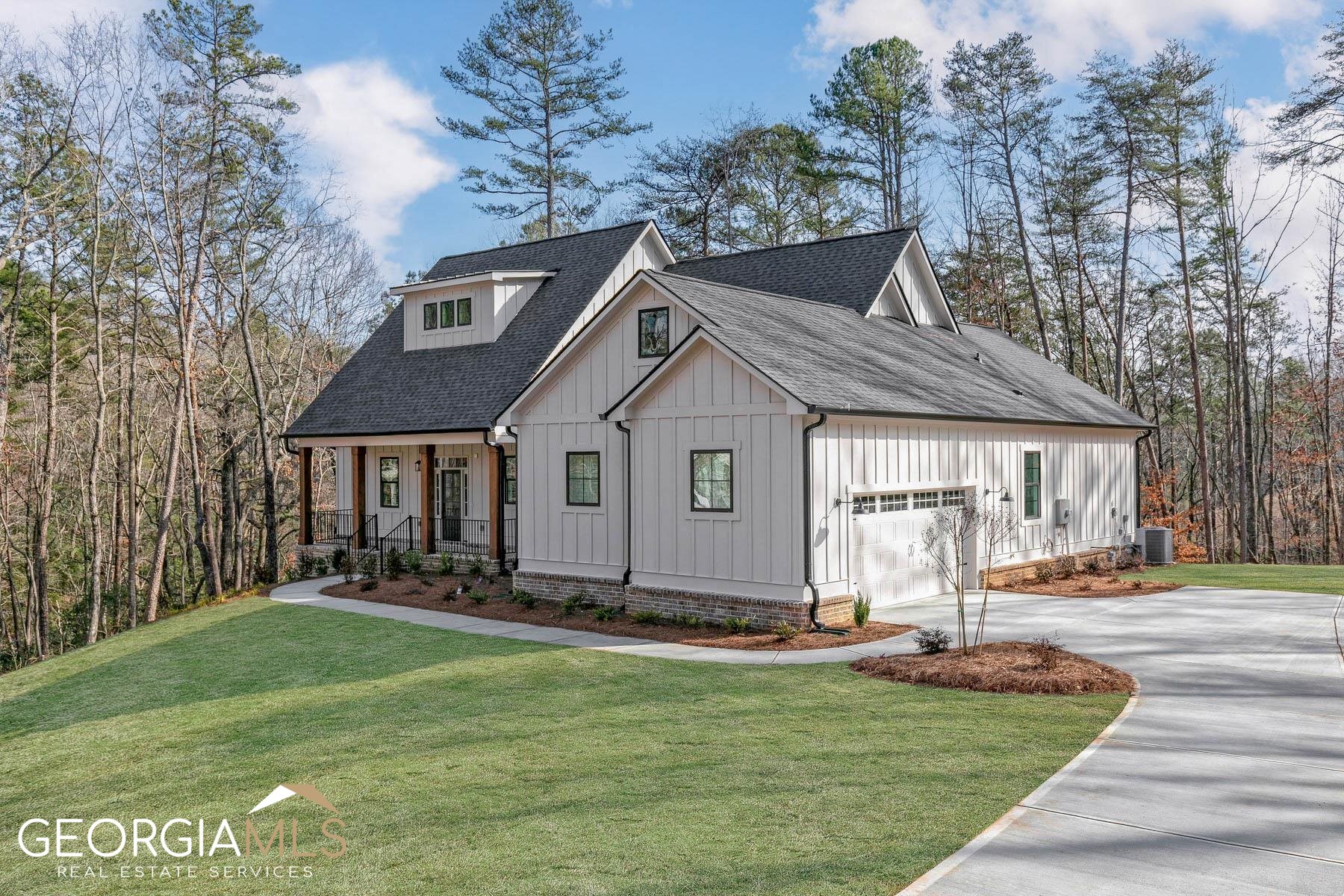 28 Brighton Road Ball Ground, GA 30107 - Photo 1 of 1 a front view of a house with a yard