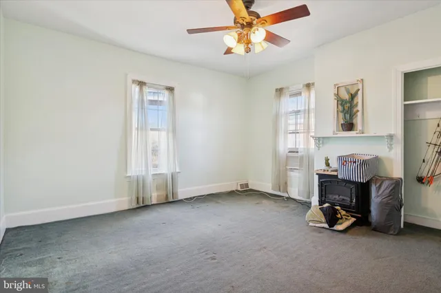 a view of room with workspace and a window