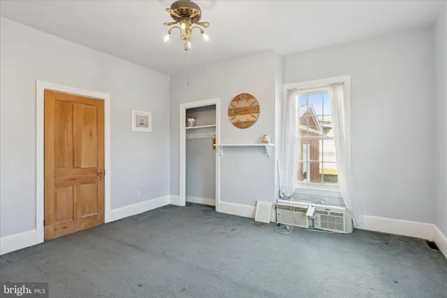 a view of an empty room with a window