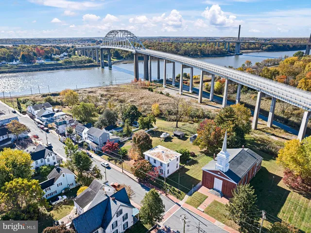 an aerial view of a house with a swimming pool yard and mountain view in back