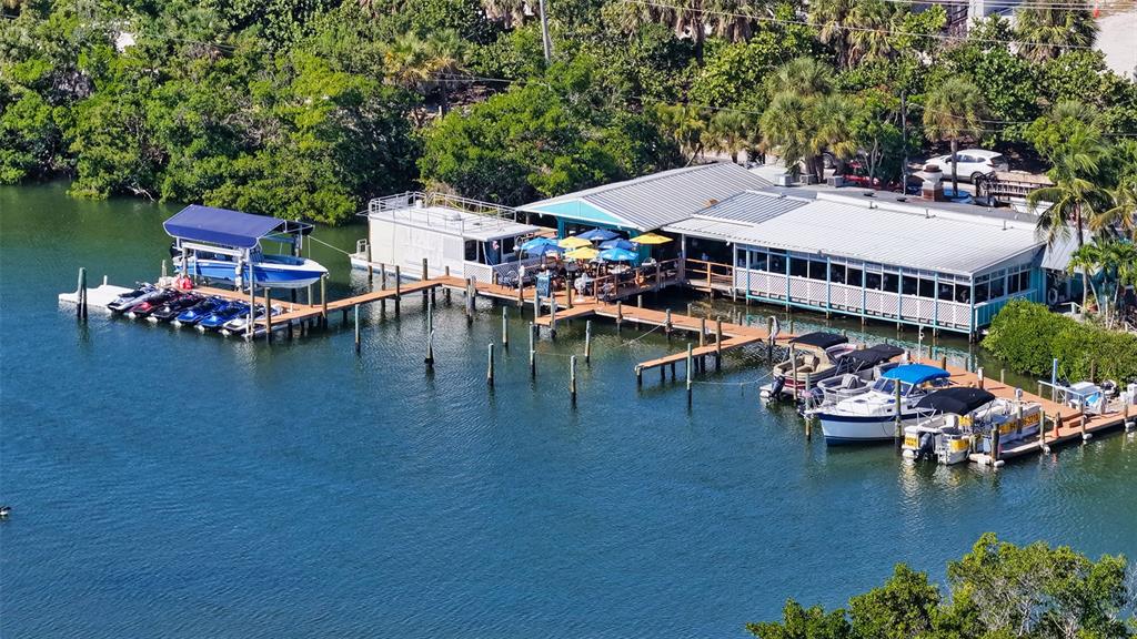 141 North Casey Key Road Nokomis, FL 34275 - Photo 44 of 45 an aerial view of a swimming pool with outdoor seating