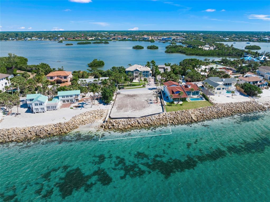 141 North Casey Key Road Osprey, FL 34229 - Photo 5 of 9 a view of lake with houses
