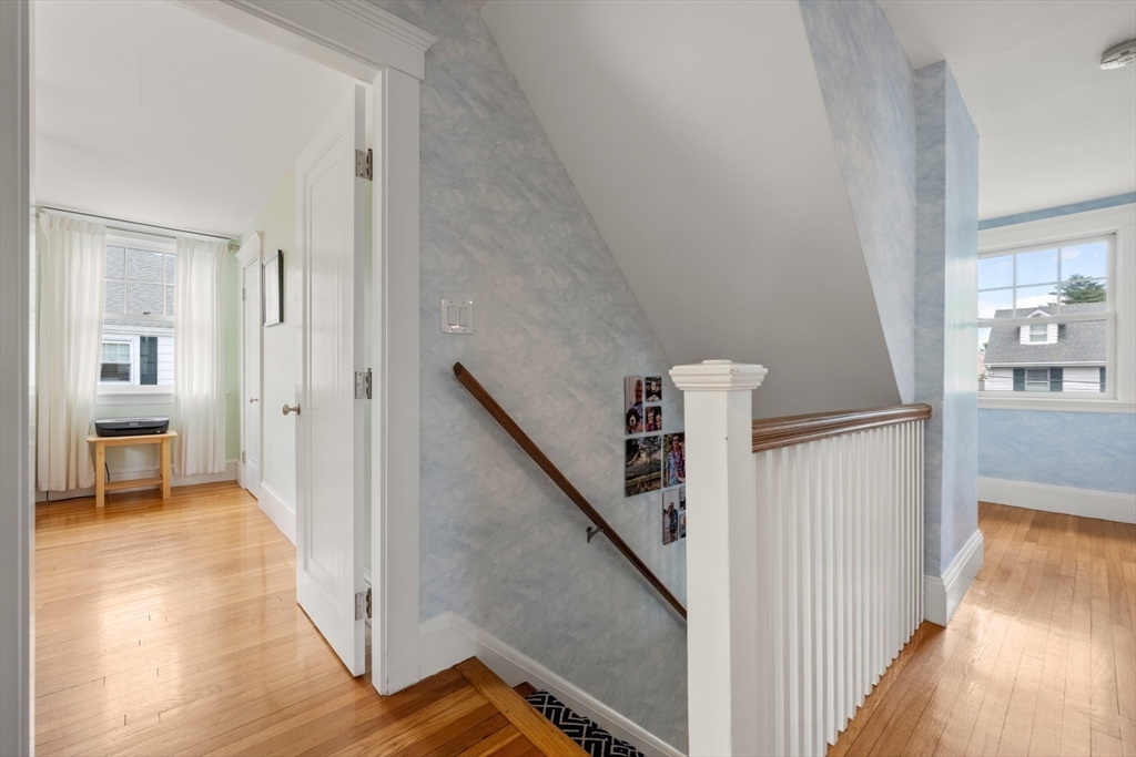 8 Charlotte Road Marblehead, MA 01945 - Photo 18 of 37 a view of a hallway with wooden floor and staircase